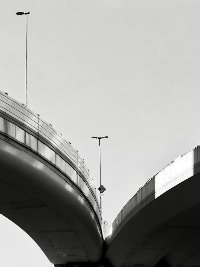 Two elevated highway ramps against a clear sky